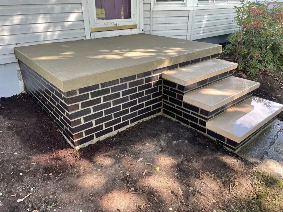 New brick porch rebuild with concrete steps